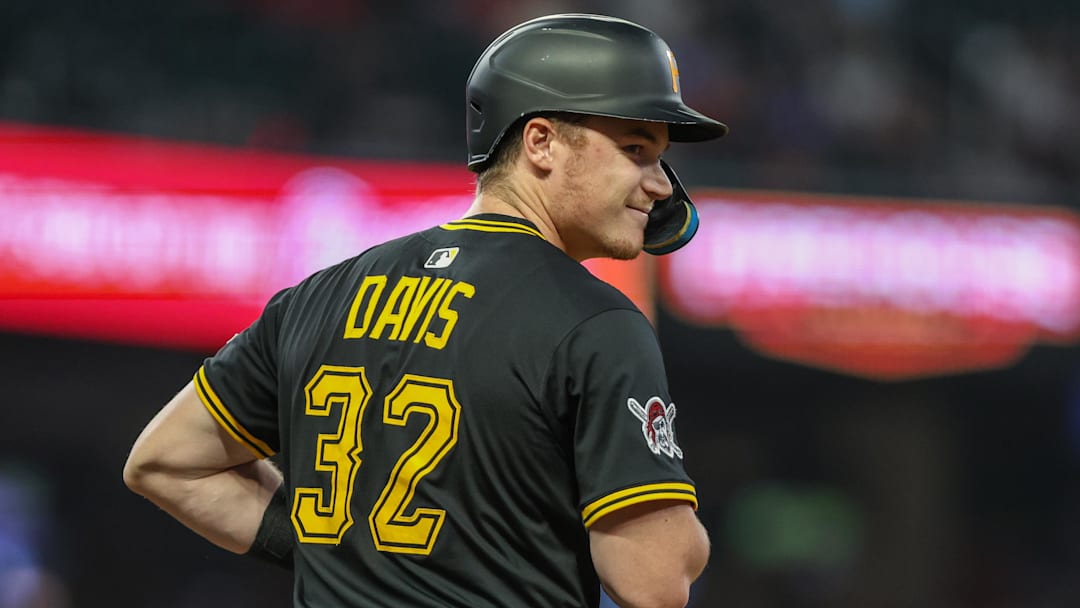 Sep 26, 2025; Cumberland, Georgia, USA; Pittsburgh Pirates catcher Henry Davis (32) smiles at first base after a hit against the Atlanta Braves during the second inning at Truist Park. Mandatory Credit: Jordan Godfree-Imagn Images