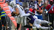 Sep 15, 2024; Baltimore, Maryland, USA; Las Vegas Raiders tight end Brock Bowers (89) runs with the ball while being tackled by Baltimore Ravens linebacker Trenton Simpson (23) during the second half at M&T Bank Stadium. Mandatory Credit: Reggie Hildred-Imagn Images