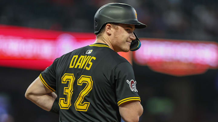 Sep 26, 2025; Cumberland, Georgia, USA; Pittsburgh Pirates catcher Henry Davis (32) smiles at first base after a hit against the Atlanta Braves during the second inning at Truist Park. Mandatory Credit: Jordan Godfree-Imagn Images