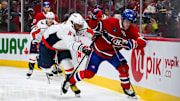 Apr 27, 2025; Montreal, Quebec, CAN; Montreal Canadiens defenseman Kaiden Guhle (21) defends the puck against Washington Capitals left wing Alex Ovechkin (8) during the second period in game four of the first round of the 2025 Stanley Cup Playoffs at Bell Centre. Mandatory Credit: David Kirouac-Imagn Images