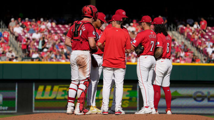 Cincinnati Reds manager David Bell, center, talks with his team as he puts in another pitcher in the 8th inning after giving up 2 two run to the Detroit Tigers. The Reds lost 5-3 at Great American Ball Park Saturday, July 6, 2024.