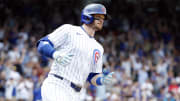 Jun 19, 2024; Chicago, Illinois, USA; Chicago Cubs outfielder Ian Happ (8) rounds the bases after hitting a solo home run against the San Francisco Giants during the fourth inning at Wrigley Field.