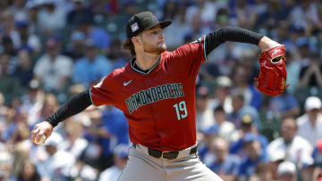 Jul 19, 2024; Chicago, Illinois, USA; Arizona Diamondbacks starting pitcher Ryne Nelson (19) delivers a pitch against the Chicago Cubs during the first inning at Wrigley Field. Mandatory Credit: Kamil Krzaczynski-USA TODAY Sports