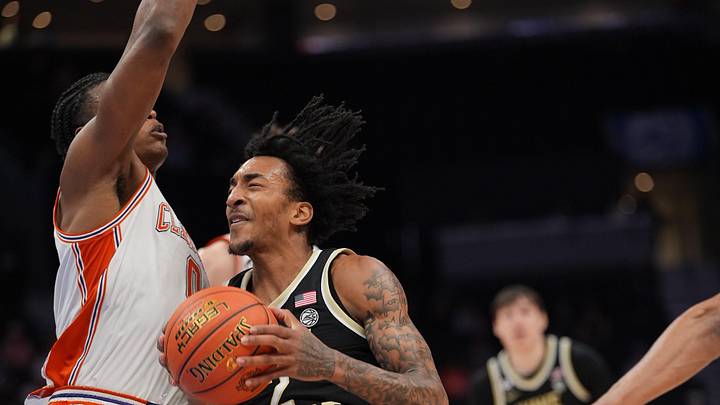 Mar 11, 2026; Charlotte, NC, USA; Wake Forest Demon Deacons forward Juke Harris (2) collides with Clemson Tigers forward RJ Godfrey (0) during the second half at Spectrum Center. Mandatory Credit: Jim Dedmon-Imagn Images