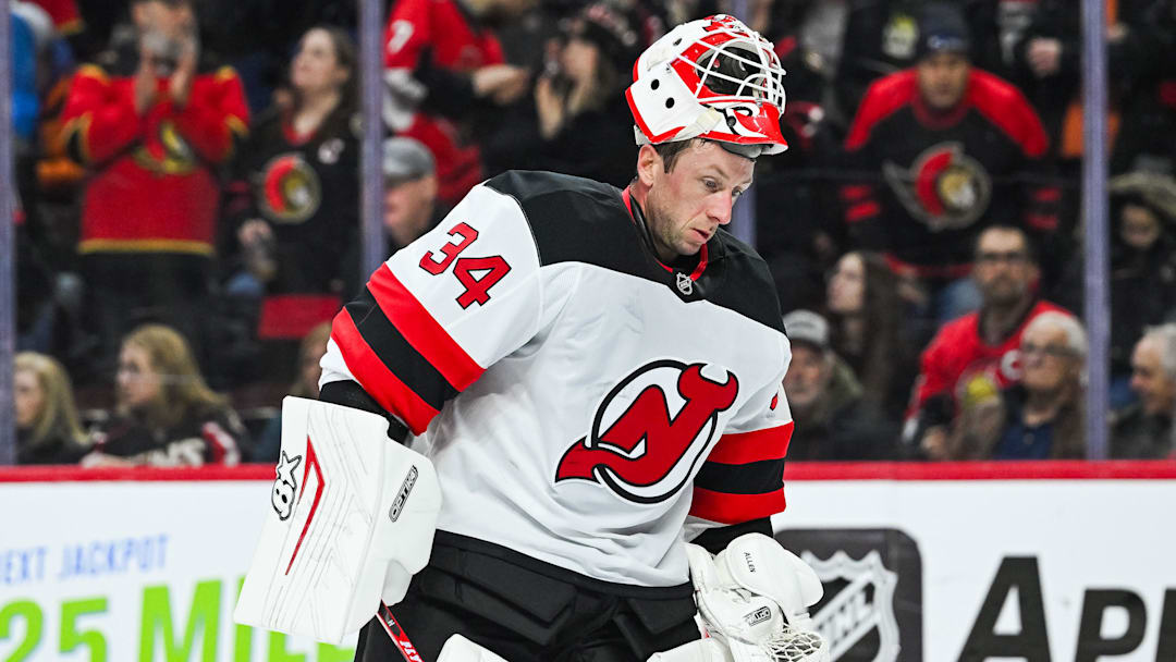 Jan 31, 2026; Ottawa, Ontario, CAN; New Jersey Devils goalie Jake Allen (34) skates back to his net with his helmet up against the Ottawa Senators during the first period at Canadian Tire Centre. Mandatory Credit: David Kirouac-Imagn Images