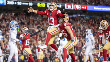 December 30, 2024; Santa Clara, California, USA; San Francisco 49ers quarterback Brock Purdy (13) celebrates with tight end George Kittle (85) after scoring a touchdown against the Detroit Lions during the second quarter at Levi's Stadium. Mandatory Credit: Kyle Terada-Imagn Images