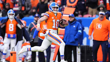 Jan 5, 2025; Denver, Colorado, USA; Denver Broncos quarterback Bo Nix (10) scrambles with the ball in the second quarter against the Kansas City Chiefs at Empower Field at Mile High. Mandatory Credit: Ron Chenoy-Imagn Images