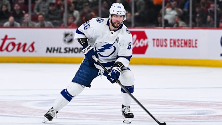 Apr 4, 2024; Montreal, Quebec, CAN; Tampa Bay Lightning right wing Nikita Kucherov (86) plays the puck against the Montreal Canadiens during the second period at Bell Centre. Mandatory Credit: David Kirouac-Imagn Images