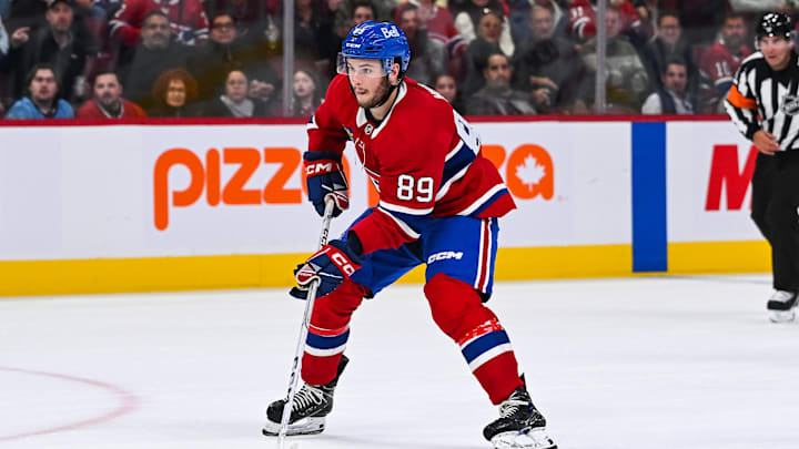 Oct 1, 2024; Montreal, Quebec, CAN; Montreal Canadiens right wing Joshua Roy (89) plays the puck against the Ottawa Senators during the second period at Bell Centre. Mandatory Credit: David Kirouac-Imagn Images