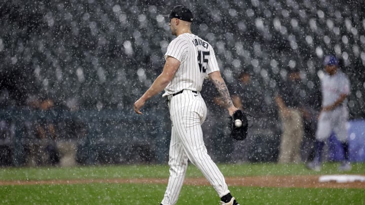 Aug 27, 2024; Chicago, Illinois, USA; Chicago White Sox starting pitcher Garrett Crochet (45) walks off the field during heavy rain in the first inning of a baseball game between the Chicago White Sox and Texas Rangers at Guaranteed Rate Field. Mandatory Credit: Kamil Krzaczynski-USA TODAY Sports