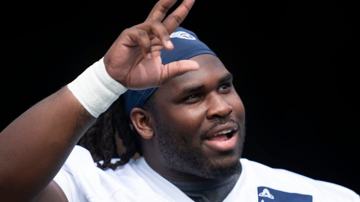 Tennessee Titans defensive tackle T'Vondre Sweat (93) waves to fans at Nissan Stadium in Nashville, Tenn., Saturday, July 27, 2024. The Titans hosted Back Together Weekend to allow fans to get a look at the retooled team.