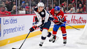 Nov 16, 2024; Montreal, Quebec, CAN; Columbus Blue Jackets defenseman David Jiricek (55) plays the puck against Montreal Canadiens defenseman Jayden Struble (47) during the third period at Bell Centre. Mandatory Credit: David Kirouac-Imagn Images
