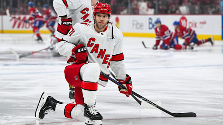 Apr 16, 2025; Montreal, Quebec, CAN; Carolina Hurricanes left wing Taylor Hall (71) kneels on the ice in warm-up before the game against the Montreal Canadiens at Bell Centre. Mandatory Credit: David Kirouac-Imagn Images