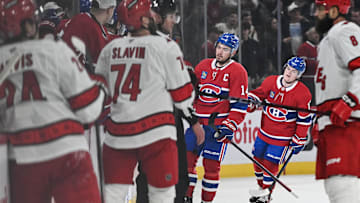 Feb 25, 2025; Montreal, Quebec, CAN; Montreal Canadiens center Nick Suzuki (14) skates back to the bench after scoring a goal against the Carolina Hurricanes in the second period at Bell Centre. Mandatory Credit: David Kirouac-Imagn Images