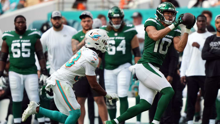 Dec 17, 2023; Miami Gardens, Florida, USA; New York Jets wide receiver Allen Lazard (10) makes a catch in front of Miami Dolphins cornerback Eli Apple (33) during the second half at Hard Rock Stadium.