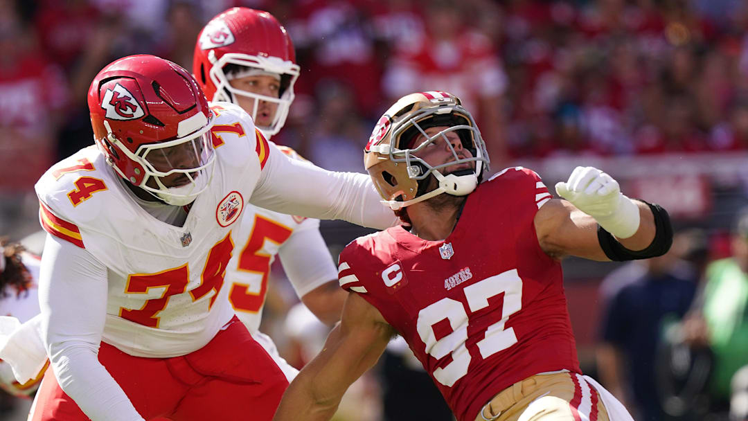 Oct 20, 2024; Santa Clara, California, USA; San Francisco 49ers defensive end Nick Bosa (97) looks up at the ball while being blocked by Kansas City Chiefs offensive tackle Jawaan Taylor (74) in the first quarter at Levi's Stadium. Mandatory Credit: Cary Edmondson-Imagn Images