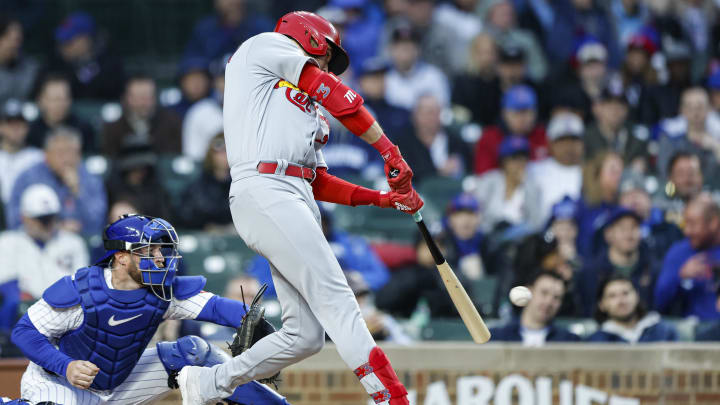 May 8, 2023; Chicago, Illinois, USA; St. Louis Cardinals center fielder Dylan Carlson (3) hits an RBI-single against the Chicago Cubs during the second inning at Wrigley Field. Mandatory Credit: Kamil Krzaczynski-USA TODAY Sports