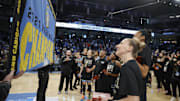 May 24, 2022; Chicago, Illinois, USA; Members of the Chicago Sky look on as the 2021 WNBA Championship Banner is revealed during a championship ring ceremony before a WNBA basketball game against the Indiana Fever at Wintrust Arena. Mandatory Credit: Kamil Krzaczynski-Imagn Images