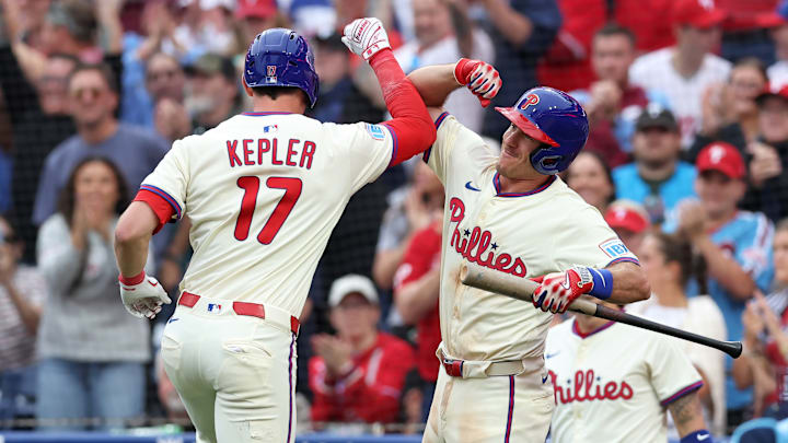 Philadelphia Phillies Max Kepler and J.T. Realmuto celebrating a home run.
