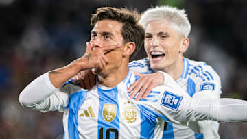 Paulo Dybala (L) of Argentina celebrates after scoring a...
