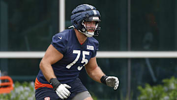 Jun 3, 2025; Lake Forest, IL, USA; Chicago Bears offensive tackle Ozzy Trapilo (75) warms up during minicamp at Halas Hall. Mandatory Credit: Kamil Krzaczynski-Imagn Images