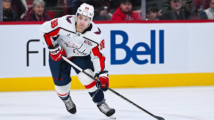 Dec 7, 2024; Montreal, Quebec, CAN; Washington Capitals left wing Andrew Mangiapane (88) plays the puck against the Montreal Canadiens during the first period at Bell Centre. Mandatory Credit: David Kirouac-Imagn Images