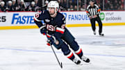 Feb 13, 2025; Montreal, Quebec, CAN; [Imagn Images direct customers only] Team USA forward Dylan Larkin (21) plays the puck against Team Finland in the first period during a 4 Nations Face-Off ice hockey game at Bell Centre. Mandatory Credit: David Kirouac-Imagn Images