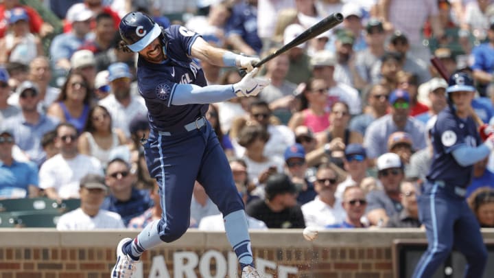 Aug 2, 2024; Chicago, Illinois, USA; Chicago Cubs shortstop Dansby Swanson (7) singles against the St. Louis Cardinals during the second inning at Wrigley Field. 