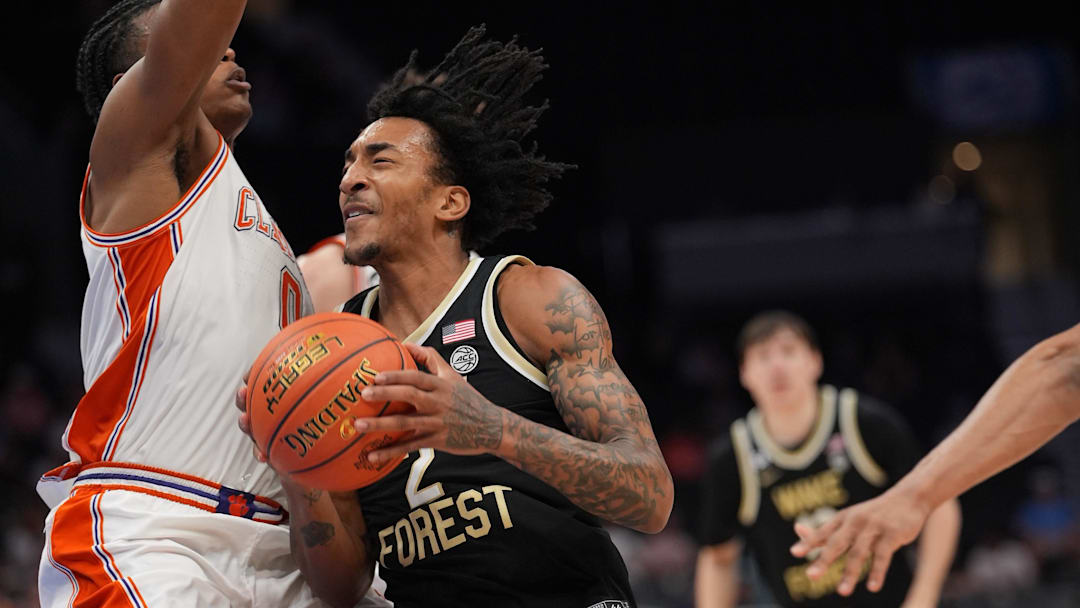 Mar 11, 2026; Charlotte, NC, USA; Wake Forest Demon Deacons forward Juke Harris (2) collides with Clemson Tigers forward RJ Godfrey (0) during the second half at Spectrum Center. Mandatory Credit: Jim Dedmon-Imagn Images