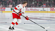 Apr 16, 2025; Montreal, Quebec, CAN; Carolina Hurricanes center Skyler Brind'Amour (76) skates with a puck during his rookie lap in warm-up before the game against the Montreal Canadiens at Bell Centre. Mandatory Credit: David Kirouac-Imagn Images