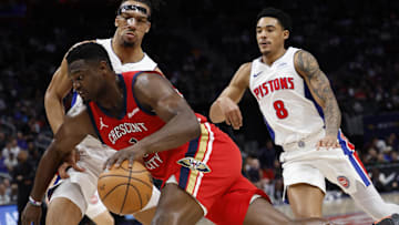  New Orleans Pelicans forward Zion Williamson (1) dribbles on Detroit Pistons forward Tosan Evbuomwan (18) in the first half at Little Caesars Arena.