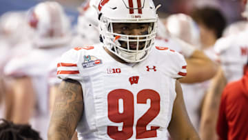 Dec 27, 2022; Phoenix, Arizona, USA; Wisconsin Badgers nose tackle Curt Neal (92) against the Oklahoma State Cowboys during the 2022 Guaranteed Rate Bowl at Chase Field. Mandatory Credit: Mark J. Rebilas-Imagn Images