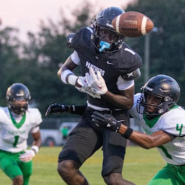 David Aboya (1) can't reel in the pass during the Choctaw vs Milton preseason football game at Milton High School on Thursday, Aug. 15, 2024.