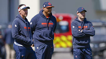 May 9, 2025; Lake Forest, IL, USA; Chicago Bears defensive coordinator Dennis Allen (L), general manager Ryan Poles (C) and head coach Ben Johnson (R) observe during the Rookie Minicamp at Halas Hall. Mandatory Credit: Kamil Krzaczynski-Imagn Images