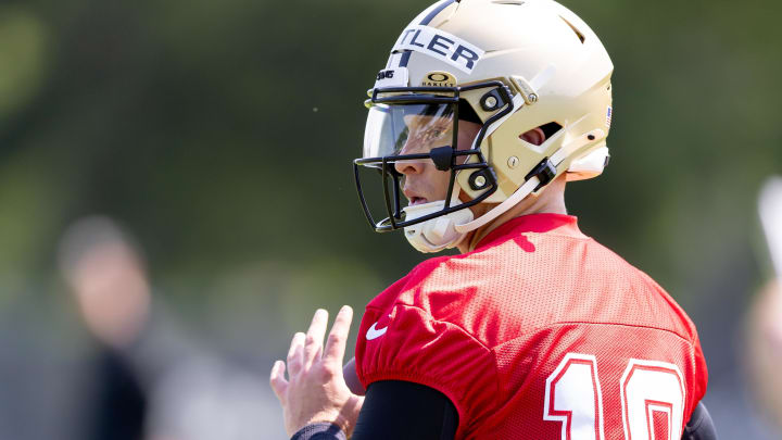 May 11, 2024; New Orleans, LA, USA;  New Orleans Saints quarterback Spencer Rattler (18) runs quarterback drills during the rookie minicamp at the Ochsner Sports Performance Center. Mandatory Credit: Stephen Lew-USA TODAY Sports