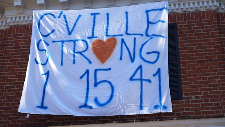 A 2022 banner honors the three Virginia players killed in a Charlottesville, Va. shooting.