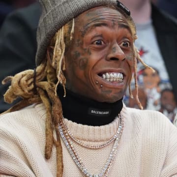 Feb 20, 2022; Cleveland, Ohio, USA; Recording artist Lil Wayne in attendance during the 2022 NBA