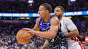 Dec 9, 2025; Orlando, Florida, USA; Orlando Magic guard Desmond Bane (3) drives to the basket against Miami Heat guard Norman Powell (24) during the second half at Kia Center. Mandatory Credit: Mike Watters-Imagn Images