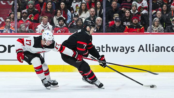 Jan 31, 2026; Ottawa, Ontario, CAN; Ottawa Senators left wing Brady Tkachuk  (7) plays the puck against New Jersey Devils defenseman Simon Nemec  (17) during the third period at Canadian Tire Centre. Mandatory Credit: David Kirouac-Imagn Images