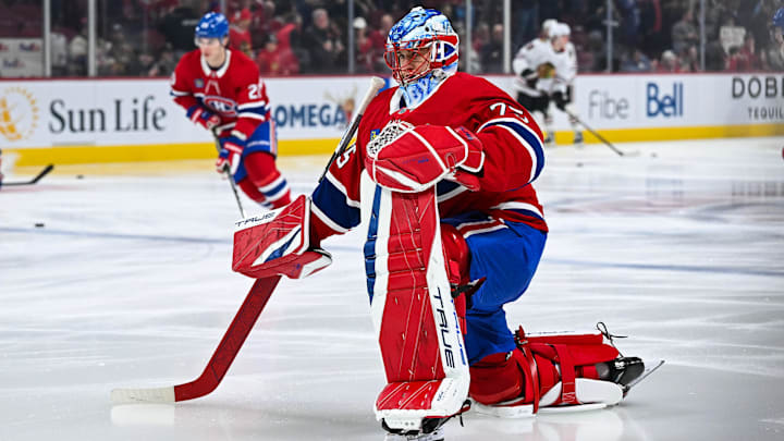 Apr 14, 2025; Montreal, Quebec, CAN; Montreal Canadiens goalie Jakub Dobes (75) kneels on the ice in warm-up before the game against the Chicago Blackhawks at Bell Centre. Mandatory Credit: David Kirouac-Imagn Images