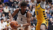 Jan 4, 2025; Gilbert, AZ, USA; Utah Prep Academy guard Anthony Felesi (1) against Oak Cliff Faith Family Academy (TX) guard Greg Lawson (5) during the Hoophall West High School Invitational at Highland High School. Mandatory Credit: Mark J. Rebilas-Imagn Images
