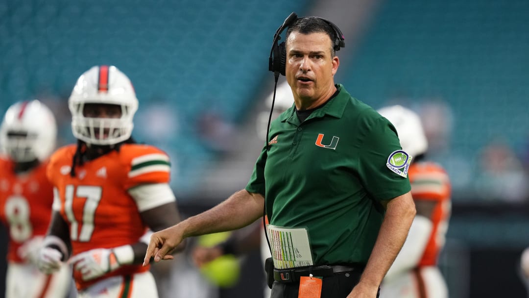 Sep 24, 2022; Miami Gardens, Florida, USA; Miami Hurricanes head coach Mario Cristobal walks onto the field.