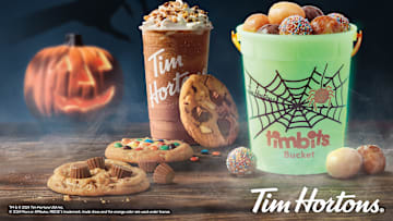 Get Your Halloween Treats and Glow-in-the-Dark Buckets at Tim Hortons! 🎃🍫 Image Credit to Tim Hortons. 