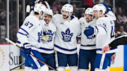 Jan 18, 2025; Montreal, Quebec, CAN; Toronto Maple Leafs defenseman Oliver Ekman-Larsson (95) celebrates with his teammates his goal against the Montreal Canadiens during the third period at Bell Centre. Mandatory Credit: David Kirouac-Imagn Images
