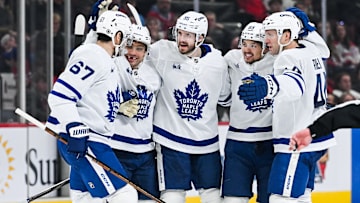 Jan 18, 2025; Montreal, Quebec, CAN; Toronto Maple Leafs defenseman Oliver Ekman-Larsson (95) celebrates with his teammates his goal against the Montreal Canadiens during the third period at Bell Centre. Mandatory Credit: David Kirouac-Imagn Images