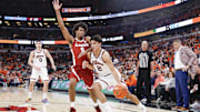 Nov 19, 2025; Chicago, Illinois, USA; Illinois Fighting Illini guard Andrej Stojakovic (2) drives to the basket against Alabama Crimson Tide forward Amari Allen (5) during the first half at United Center. Mandatory Credit: Kamil Krzaczynski-Imagn Images