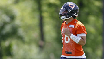 May 31, 2024; Lake Forest, IL, USA; Chicago Bears quarterback Caleb Williams (18) runs on the field during organized team activities at Halas Hall. Mandatory Credit: Kamil Krzaczynski-USA TODAY Sports