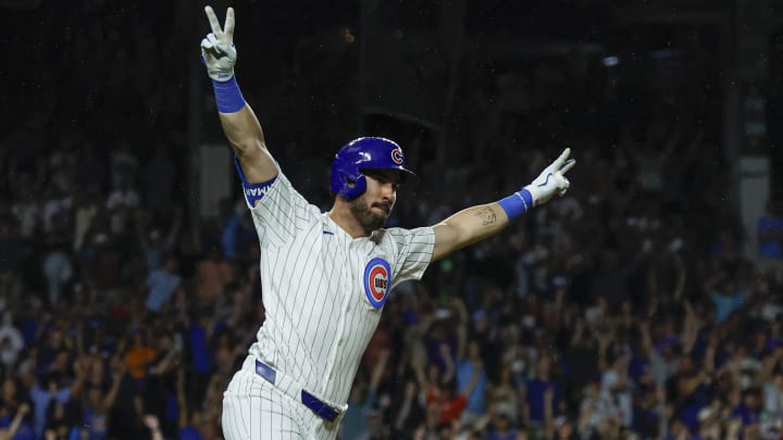 Aug 1, 2024; Chicago, Illinois, USA; Chicago Cubs outfielder Mike Tauchman (40) celebrates his walk-off single against the St. Louis Cardinals during the ninth inning at Wrigley Field.