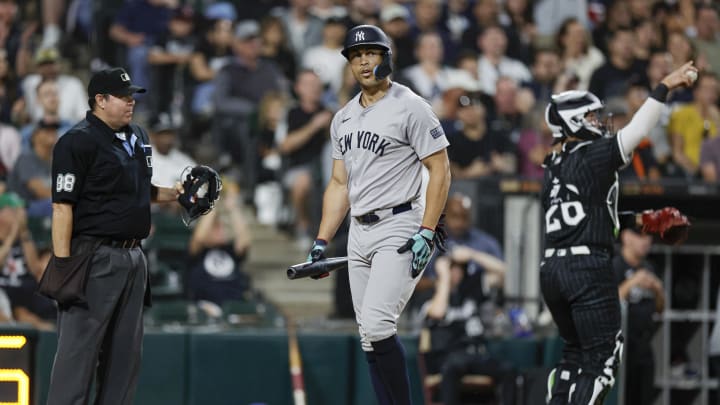 Aug 12, 2024; Chicago, Illinois, USA; New York Yankees designated hitter Giancarlo Stanton (27) reacts after striking out against the Chicago White Sox during the fourth inning at Guaranteed Rate Field.