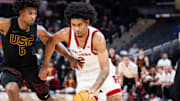 Mar 12, 2025; Indianapolis, IN, USA;  Rutgers Scarlet Knights guard Dylan Harper (2) dribbles the ball while USC Trojans guard Wesley Yates III (6) defends in the second half at Gainbridge Fieldhouse. Mandatory Credit: Trevor Ruszkowski-Imagn Images